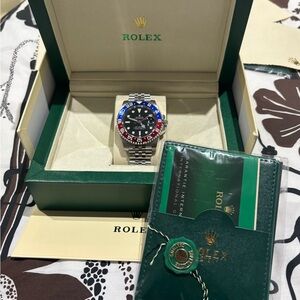 Rolex Men's Black, Silver, and Blue Watch